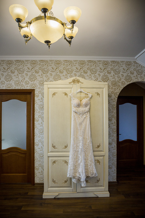 bridesmaid dress hanging on the closet in the roomの写真素材