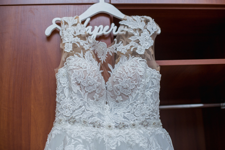 bridesmaid dress hanging on the closet in the roomの写真素材