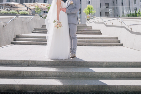 bride and groom on the big staircaseの写真素材
