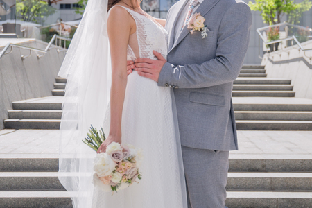 bride and groom on the big staircaseの写真素材