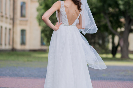 bride with veil and wedding dress in the squareの写真素材