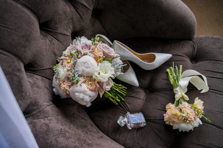bridal bouquet with shoes on the chairの写真素材