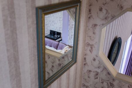 beautiful stylish room interior with sofa mirrorの写真素材