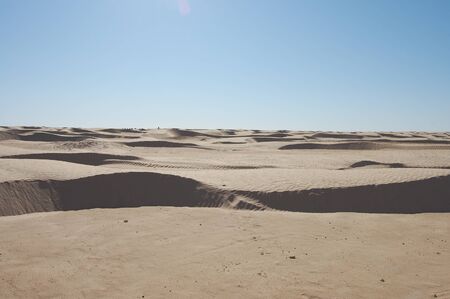 sand dunes in the sahara desert africa blue skyの写真素材