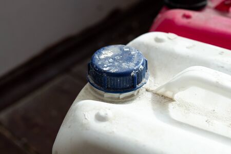 dirty plastic canisters for repairing a mixture