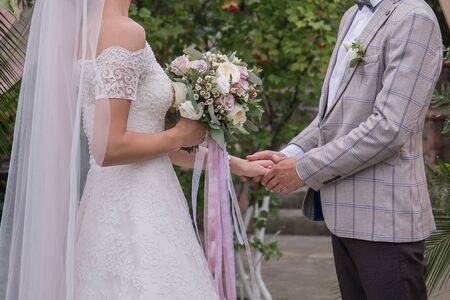 the bride and groom at a wedding ceremonyの写真素材