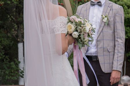 the bride and groom at a wedding ceremonyの写真素材
