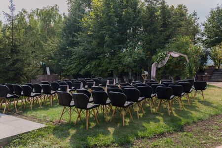 decor of arches and chairs for wedding ceremonyの写真素材