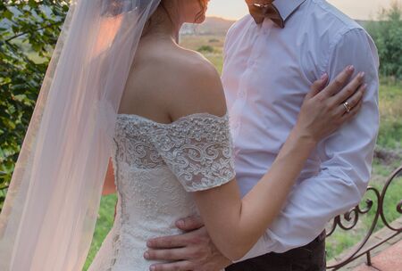bride and groom in evening at sunsetの写真素材