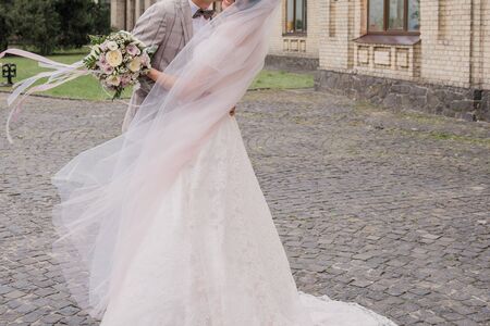 bride and groom in summer park togetherの写真素材