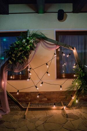 arch for the wedding ceremony in eveningの写真素材