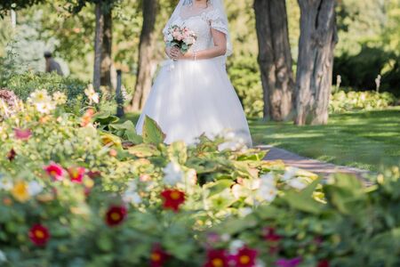 bride and groom in the park togetherの写真素材