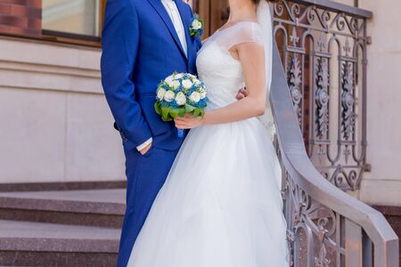 bride and groom on the veranda of houseの写真素材