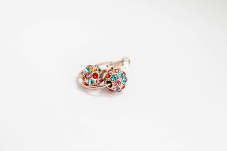a gold earrings with colorful stonesの写真素材