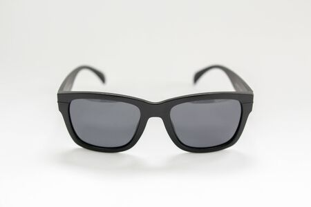 black men's sunglasses from a sun on whiteの写真素材