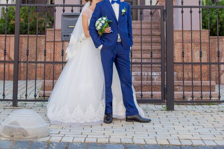 bride and groom on the veranda of houseの写真素材