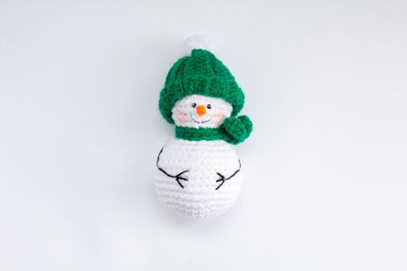 knitted snowman on white backgroundの写真素材