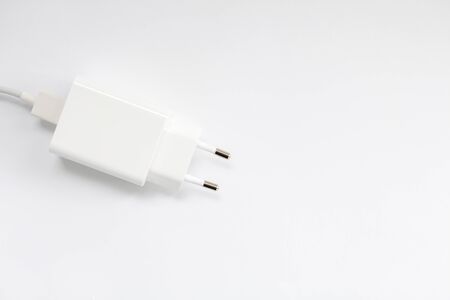 white mobile charger on white backgroundの写真素材