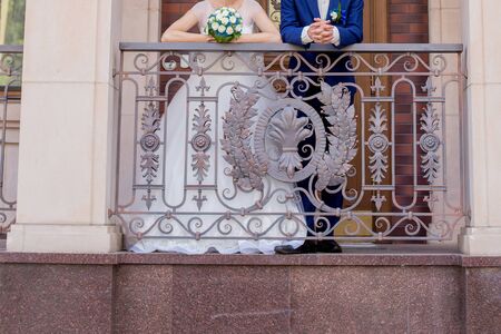bride and groom on the veranda of houseの写真素材