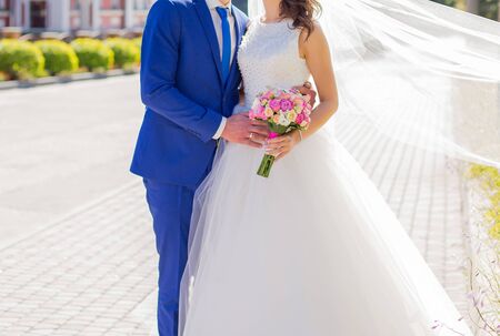 bride and groom in park among the treesの写真素材
