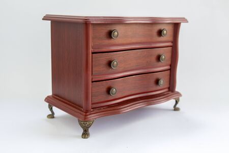 wooden chest of drawers on white backgroundの写真素材