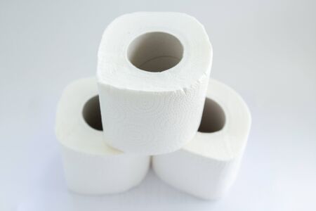 toilet paper rolls on white backgroundの写真素材