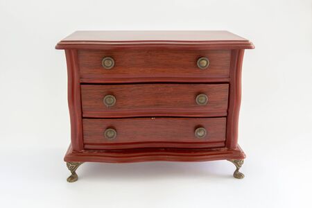 wooden chest of drawers on white backgroundの写真素材