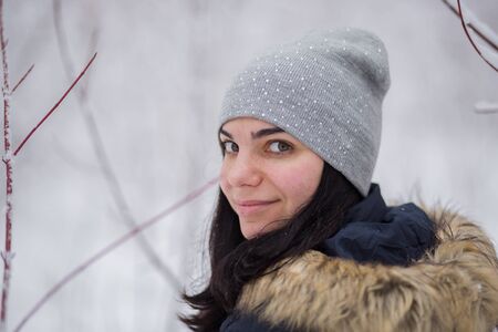woman with husky dog in winter in snowの写真素材