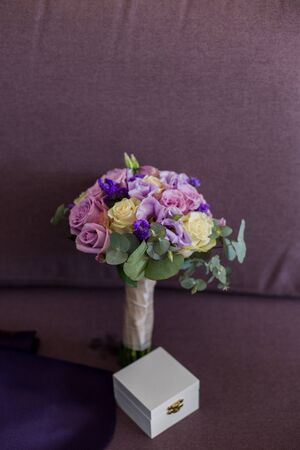 the bride bouquet lies on sofaの写真素材