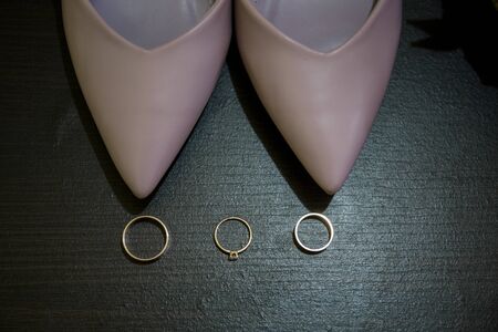 wedding rings with bouquet and shoesの写真素材