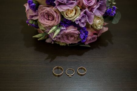 wedding rings with bouquet and shoesの写真素材