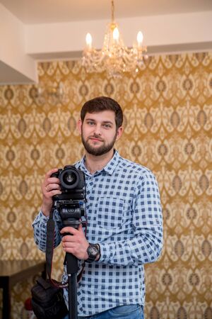 a man with beard camera and a monopodの写真素材