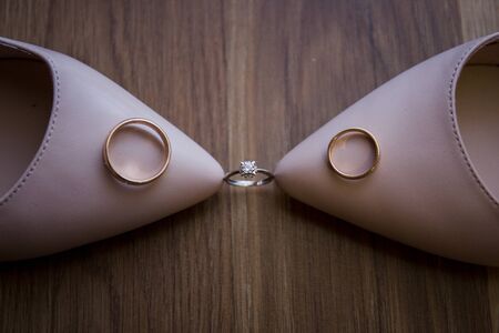a wedding shoes with wedding ringsの写真素材