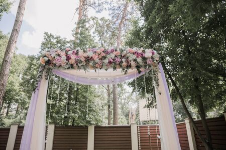 arch for a wedding ceremony of flowers in parkの写真素材