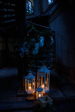vintage lamps with candles on street at nightの写真素材