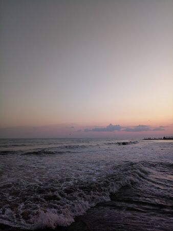 sunset on sea with muddy waterの写真素材