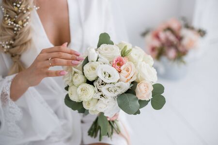 bride in a wedding dress with bouquetの写真素材