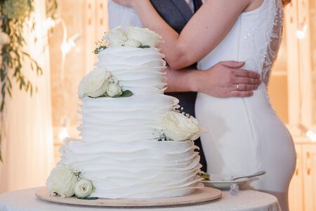 bride and groom cut wedding cakeの写真素材