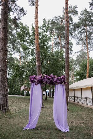 arch for wedding ceremony of flowers in the parkの写真素材