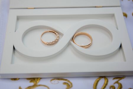 wedding rings in a box with inscription loveの写真素材