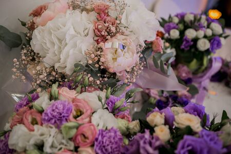 banquet table in a restaurant with flower decorの写真素材