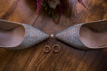 a shoes with rhinestones and wedding ringsの写真素材