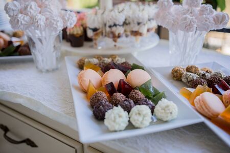 a candy bar with sweets at the partyの写真素材