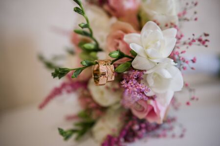 gold wedding rings on table