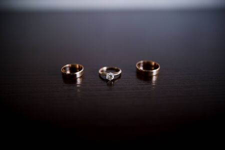 a wedding engagement rings on the tableの写真素材