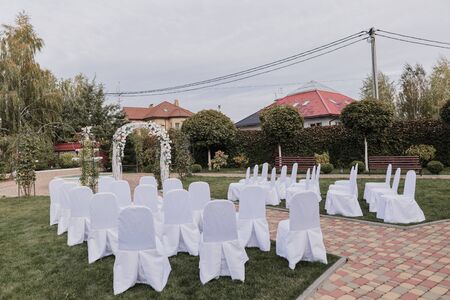 arch for wedding ceremony with flowers in parkの写真素材