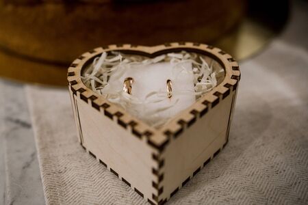 wedding gold rings in wooden box
