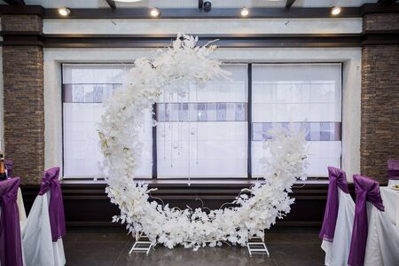 round arch for wedding ceremony indoorsの写真素材