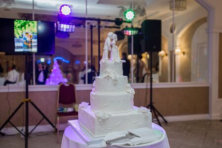 large white wedding cake in eveningの写真素材