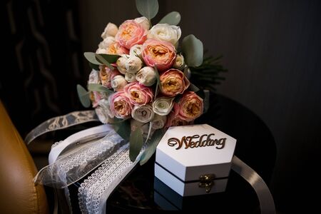 wooden box for wedding rings with bouquet